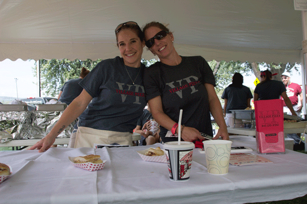 Renee Mitchell (right) and Meghan Wagner (left) were all smiles while serving ice cream to customers.
