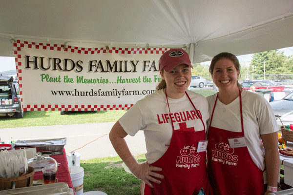Colleen Taylor (left) and Jillian Grennan (right) selling apple products for Hurds Family Farm.