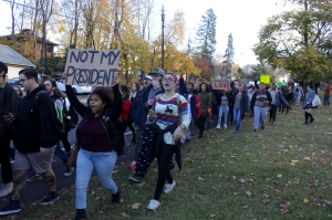 Hundreds of students walk the streets of town yelling “Not My President!” during the Walkout for Solidarity Against Trump on Friday. 