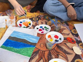 Students gathered on Parker Quad to celebrate the Halloween season at a Halloween-themed painting event hosted by the New Paltz Dance Team.