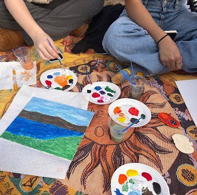 Students gathered on Parker Quad to celebrate the Halloween season at a Halloween-themed painting event hosted by the New Paltz Dance Team.